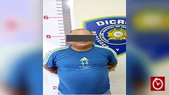 Revólver ilegal en La Vega ocupado por agentes del DICRIM durante allanamiento.
